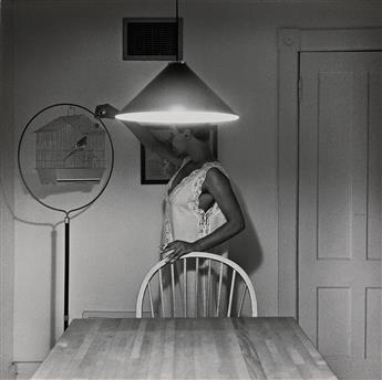 CARRIE MAE WEEMS (1953 - ) Untitled (Woman Feeding Bird).                                                                                        